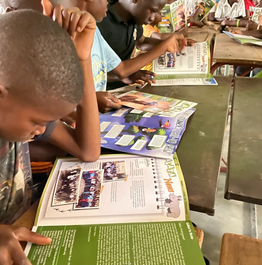 Zambian kid reading Kalata Magazine